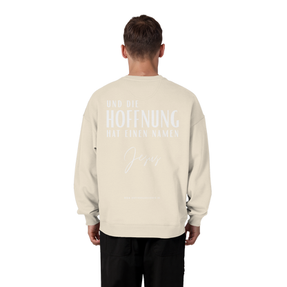 Die Hoffnung hat einen Namen - Jesus - Heavy Oversize Sweatshirt