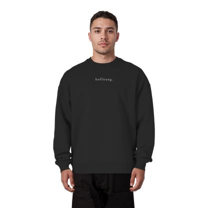 Die Hoffnung hat einen Namen - Jesus - Heavy Oversize Sweatshirt