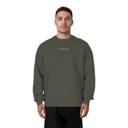 Die Hoffnung hat einen Namen - Jesus - Heavy Oversize Sweatshirt