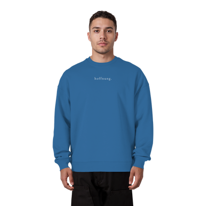 Die Hoffnung hat einen Namen - Jesus - Heavy Oversize Sweatshirt